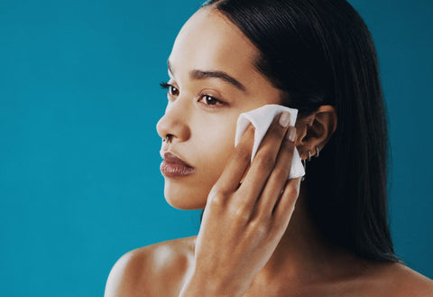 Lady removing makeup with baby wipes