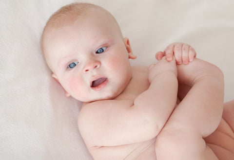 Small baby looking off camera