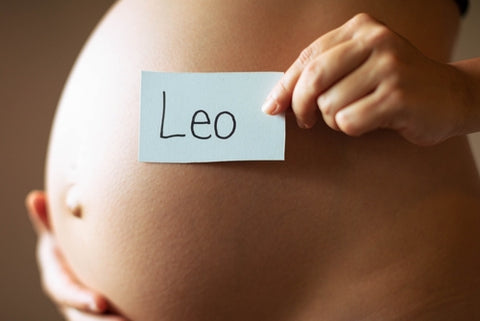 Baby bump with Leo sign next to it