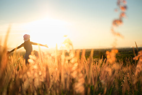 Woman dancing in sunshine 