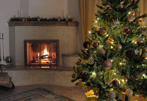 Real Fir Christmas tree by an open fire