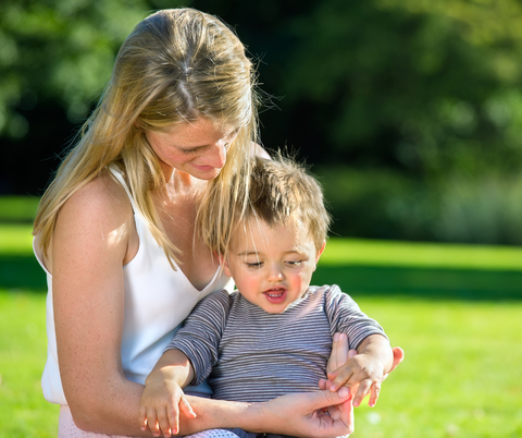 Mother holding their child