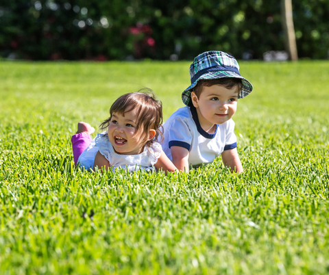 Kids lying in the grass