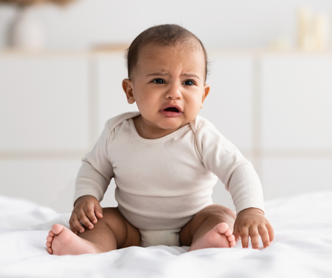 A baby who is crying.